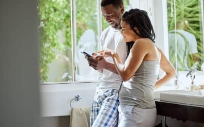 Phone, morning and black couple in bathroom in home on social media, networking or internet